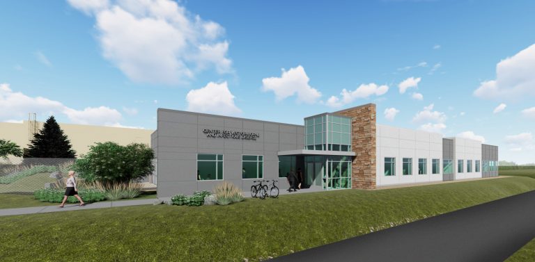 Rendering of the Center for Vector-Borne Infectious Diseases (CVID) at CSU’s Foothills Campus, showing a modern single-story research building with stone and glass accents surrounded by landscaped greenery.